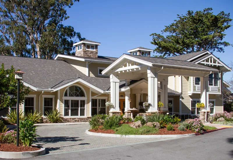 Single-story senior living community with a craftsman-style entry